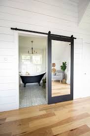 Black And White Barn Door Modern Black And White Bathroom With Brass Accents Inside Barn Doors Barn Door Designs Sliding Door Design