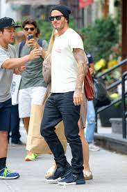 The former footballer, 41, ventured out onto the snow covered pavements in his trademark baker boy camel coloured cap as he held onto his little. David Beckham Fashion Summer