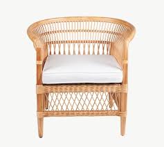 It's available in a variety of upholsteries, but bonded leather is the most classic. Jonqui Rattan Accent Chair Pottery Barn