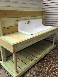 1920s Farm Sink Turned In To A Garden Potting Bench My Hubby Is Amazing Potting Bench With Sink Potting Bench Outdoor Sinks
