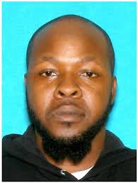 Suspect at-large charged with murder at South Bend gas station