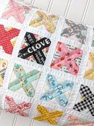 Step 3d flip row 3 right side up and your cross quilt block is finished! Fabric Mutt Cross Stitch Quilt Block Pillow Tutorials
