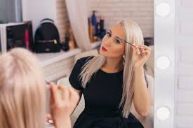Warm up your black, asian hair with a chestnut brown balayage bob. Premium Photo Stylish Blonde Hair Girl In Black Dress Brushing Her Brows Looking At The Mirror In Beauty Salon