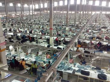 Industrial Scalability: Inside our high-capacity vertical garment production facility in Dhaka., AI generated