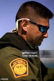 U.S. Border Patrol agent Edwin Millan takes finger prints from a... News  Photo