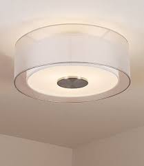 The ceiling lamp is attached to a cuboid base on the ceiling and consists of three offset, long ellipses that overlap and run parallel to each other, which ensures that a large area is illuminated. 32 Transitional Corporate Lobby Ideas Ceiling Lights Lighting Bover
