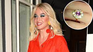 Here's the significance behind the center stone's hue. Katy Perry S Engagement Ring Sparkles On Date With Orlando Bloom