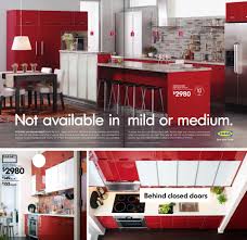 living with red kitchen cabinets at