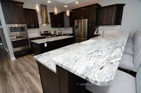 Showroom at baan&beyond , south pattaya. White Granite With Black And Grey Minerals White Granite Countertops Backsplash With Dark Cabinets Espresso Cabinets
