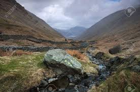 Mountains generally are understood to be larger than hills, but the term has no standardized geological meaning. Stream Flowing Between The Beautiful Lake District Mountains Stock Photo Picture And Royalty Free Image Image 9019882