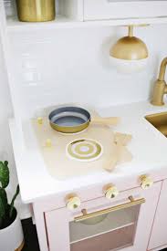 The kids love the new and improved version of their kitchen and it looks so fab in their playroom. Mid Century Modern Ikea Play Kitchen Hack A Beautiful Mess