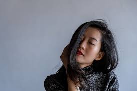 My hair color does not define my youth! Hd Wallpaper Woman In Grey Top Closing Eyes One Person Gray Hair Young Women Wallpaper Flare