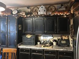 Farmhouse Primitive Decor Above Kitchen Cabinets With Black Cabinets Above Kitchen Cabinets Kitchen Cabinets Decor French Country Kitchen Cabinets