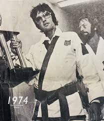 Red West was a bodyguard for Elvis. Part of that “Memphis Mafia” along with  his cousin Sonny West. Red is seen here with Elvis accepting a trophy 🏆 for  his karate skills.
