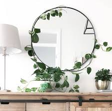 It S Only Been A Week Since I Hooked Our Devils Ivy Around Our Mirror In The Entryway But It S Safe To Say Decor Wall Decor Living Room Mirror Wall Living Room