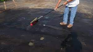 How to clean oil spots from asphalt driveway. How To Clean Bad Oil Stains On Asphalt Youtube