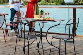 Timeless Louvre Chair Paired With An Opera Table Crafted In The Heart Of France Explore The Options Including All Outdoor Tables Outdoor Furniture Nz Fermob