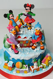 I made this cake for my granddaughter's minnie themed 2nd birthday party. Mickey And His Friends In Winter Time Christmas Themed Cake Mickey And Minnie Cake Mickey Mouse Clubhouse Birthday Cake