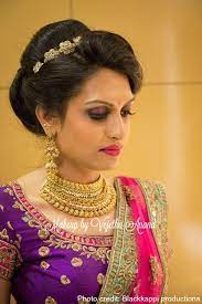 Indian Bride Akshaya Wears Gorgeous Pink And Purple Bridal Lehenga And Jewelry For Indian Wedding Hairstyles Lehenga Hairstyles Bridal Hairstyle For Reception