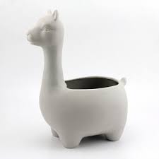 Made from ceramic earthenware, these whimsical planters are a fun way to work some greenery into your space. Large White Ceramic Llama Planter