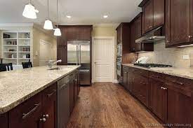 Wood floors with white trim. Walnut Color And Floor Combo 122012 Brown Kitchen Cabinets Kitchen Cabinet Design Dark Wood Kitchen Cabinets