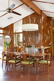 This dining room feels both moody and bright thanks to the rich blue walls and bright kilim. Dining In Style Ideas For A Mid Century Modern Dining Room Home