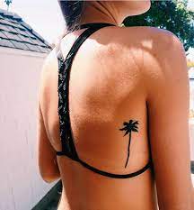 Trees represent a natural existence of something as well as strength and growth. Minimal Palm Tree Tattoo On Back