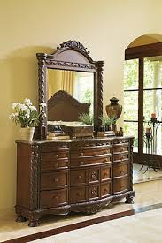 Inspired by the grandeur and grace of old world traditional style, the north shore canopy bed is nothing short of stunning. North Shore Collection Ashley Furniture Homestore