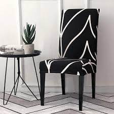 A smattering of verdant greenery adds to the natural, organic appeal of the space. Black White Abstract Stripe Dining Chair Cover Decorzee