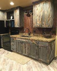 Custom kitchen cabinets made from reclaimed barn wood. Barn Wood Cabinets But Add A Concrete Counter Top Farm Sink And An Old Fashioned Sink Nozzle Rustic Kitchen Rustic Kitchen Cabinets Rustic House