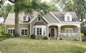 Warm Gray Creamy White Stained Door And Stone Accent This House Has It All Exterior House Colors House Exterior Bay Window Exterior