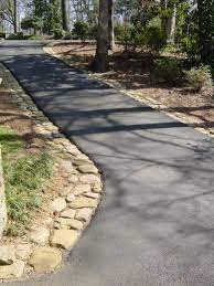 Whether you want to keep your recently paved asphalt driveway looking brand new or extend the life of an older driveway, sealcoating is a worthwhile investment. Pin By Heather Moll Dunn Landscape De On Creative Driveways Driveway Ideas Cheap Driveway Landscaping Driveway Edging
