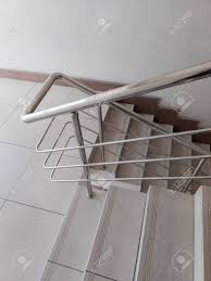 For fully tiled stairs, be sure to consult a professional about the best tiles to use. Modern Design Of Stanless Steel Pipes Handrail And Ceramic Tiles Stock Photo Picture And Royalty Free Image Image 151409537