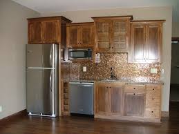 Parker, colorado basement finishing project. Ldk Wet Bar With Full Sized Refrigerator Dishwasher And Microwave Custom Wood Cabinetry And Tile Backsplash Small Bars For Home Basement Bar Designs Wet Bar