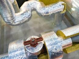 Insulated pipes in a basement prepared for winter.