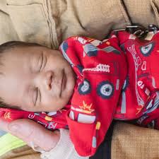 Couple adopts adorable baby left behind at fire station when he was just  two days old