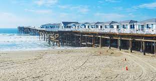 On april 19, 1936, almost exactly ten years after the initial dedication, a new and remodeled pier, complete with ten motel cottages and a soda fountain, opened for vacationers. Crystal Pier Hotel Cottages San Diego Ca California Beaches