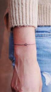 Heart Love And Affection Small Wrist Tattoos With Powerful Meanings Small Tattoo Designs Me Tattoo Designs Wrist Small Wrist Tattoos Arm Band Tattoo
