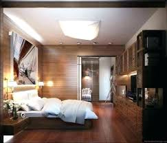 A contrasting bedroom wiht a black bed, open shelves, a potted plant and a pendant. Modern Bedroom Decorating Ideas House N Decor