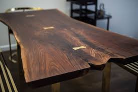 Black Walnut Slab Dining Table With Polished Brass Bowtie Keys And Hoop Legs This Stunning Black Walnut Dining Table Slab Table Live Edge Slab Dining Tables