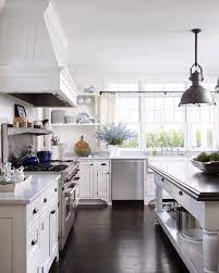 A Classic White Kitchen Never Goes Out Of Style Especially When It Has A Farm Table Island And Loads Of N Kitchen Styles French Kitchen Interior Home Kitchens