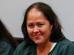 Woman accused of killing her children, husband poses for pictures at court  appearance