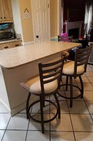 Create your own breakfast nook in the kitchen, jazz up your kitchen island or complete that entertainment room in the basement with this colorful metal counter stool. Holland S Jackie Extra Tall Swivel Stool In Stainless Bronze More