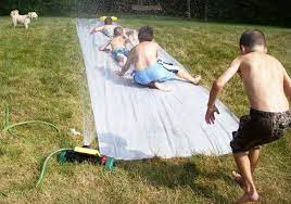 Heavy duty plastic/tarp (i will review the best plastic/tarp for a slip and slide below) plastic stakes. Diy Slip N Slide Genius Bob Vila