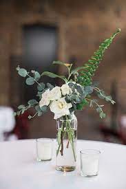 Simple Garden Wedding Cocktail Centerpiece With Greenery Roses And Votive Flower Centerpieces Wedding Elegant Wedding Centerpiece Wedding Floral Centerpieces