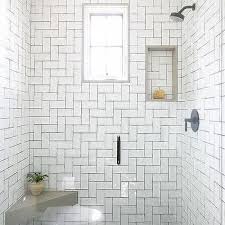 For small bathrooms, mirrored subway tiles are a great way to add visual square footage to give the appearance of a larger, and brighter space, perfect for bathrooms lacking in natural light. White Shower Tiles With Black Grout Design Ideas