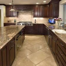 The dark stone plays well with gray cabinets and can work in modern, chic kitchens as well as more traditionally inspired ones. 39 Beautiful Kitchen Floor Tiles Design Ideas Kitchen Backsplash Tile Designs Cherry Cabinets Kitchen Kitchen Floor Tile