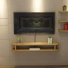 White glossy closed unit is there to hide and keep your gadgets safe. Small Apartment Modern Minimalist Wall Mounted Tv Cabinet Living Room Wall Set Top Box Rack Solid Wood Tv Stands Aliexpress