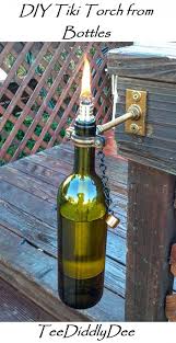 How To Frame Canvas Pictures Teediddlydee In 2020 Wine Bottle Tiki Torch Wine Bottle Tiki Tiki Torches
