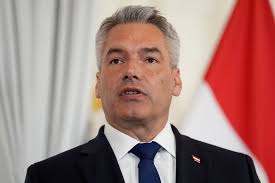 Austrian chancellor to remain in government coalition despite his  minister's controversial EU vote